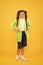 Rainy day. Cute schoolgirl feel protected for spring weather. Waterproof concept. Kids raincoats with vibrant shapes