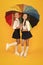 Rainy day. Happy childhood. School time. Rainbow umbrella. Colorful life. Schoolgirls happy big umbrella. Fall weather