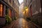 rainy day on a narrow cobblestone alley