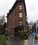 Rainy day in New York, narrow building with flower shop