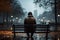 Rainy day repose person on a bench, city view obscured