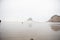 Rainy day shot of the ocean from the Pacific Coast Highway with overcast skies and roaring waves