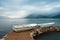 Rainy day. Two white fishing boats on the shore. Montenegro, Bay of Kotor