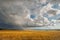 Rainy fields and open spaces in the steppes of Tuva against the background of sunset clouds