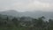 Rainy morning in tropical to a garden. The sun rises over mountains, Bali. Indonesia