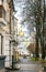 Rainy spring morning in the old town. People walking through the historic center in Poltava, Ukraine