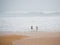 Rainy tropical island and people on the beach