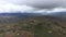 Rainy weather in Colombia. Filandia landscape and wild nature, aerial view. Huge dark clouds.