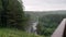 Rainy weather in forest area with mountain river. Stock footage. Beautiful landscape with torrential rain over