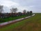 A rainy weather over the dam protecting a village from a cold Northern sea