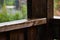 Rainy weather. Raindrops reflecting off the wooden railing of the terrace. A storm and a shower