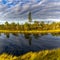 Raised bog and marsh landscape under an expressive sky