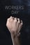 Raised fist and text workers day