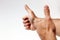 Raised thumbs isolated on a white background. Symbol of success