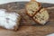 Raisin cake, dusted with icing sugar. Cupcake with raisins on a wooden board.