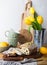 Raisin cake on a wooden board with lemon and yellow tulips