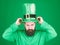 The raising of the green. Hipster in leprechaun costume touching hat. Irish man with beard wearing green. Bearded man