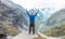 Raising Hands on the edge of a mountain in Himalaya Mountain Range