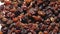 raisins. close-up. rotation food. Raisins background rotate slowly, top view. Dried fruit, light and dark raisins for