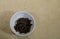 raisins on white plate, ingredient of & x22;chile en nogada& x22;, typical dish of gastronomy in puebla, Mexico