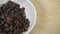 raisins on white plate, ingredient of & x22;chile en nogada& x22;, typical dish of gastronomy in puebla, Mexico