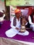 A rajasthani folk musician plays a seventeen-string musical instrument called kam.aicha