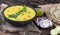 Rajasthani And Gujarati Traditional Cuisine Kadhi or Bajra Roti on Vintage Wooden Background