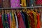 Rajasthani womens clothes  are hanging for sale , being displayed in a shop at famous Sardar Market and Ghanta ghar Clock tower in