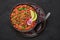 Rajma Masala Curry in black bowl on dark slate table top. Red Kidney Bean Dal is indian cuisine vegetarian dish