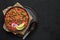 Rajma Masala Curry in black bowl on dark slate table top. Red Kidney Bean Dal is indian cuisine vegetarian dish