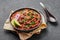 Rajma Masala Curry in black bowl on dark slate table top. Red Kidney Bean Dal is indian cuisine vegetarian dish