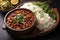 Rajma Masala Curry in black bowl on dark slate table top. Red Kidney Bean Dal is indian cuisine vegetarian dish. Asian food, meal