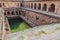 Rajon Ki Baoli step well in the Mehrauli Archaeological Park in Delhi, Ind