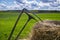 Rake and scythe on dried straw in a field