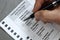 Raleigh, North Carolina / USA - September 12, 2020: Close-up of a hand with pen filling out an Absentee Ballot for North Carolina