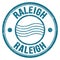 RALEIGH text written on blue round postal stamp sign