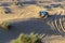 Rally off-road car 4x4 adventure driving safari on sand dunes on