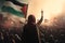 At a rally in solidarity with Gaza, an Arab woman proudly holds a Palestinian flag