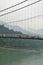 Ram Jhula hanging bridge, Rishikesh, India. The river Ganges