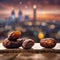 A Ramadan Atmosphere is Evident in the Image of Dates Fruit Against a Dusk Cloudy Sky and City Backdrop