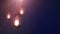 Ramadan candle lantern falling down hanging on string blue background