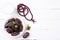 Ramadan food and drinks concept. Wood rosary, milk and dates fruit on a white wooden table background. Top view, Flat lay