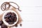 Ramadan food and drinks concept. Wood rosary, milk and dates fruit on a white wooden table background. Top view, Flat lay