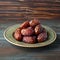 Ramadan iftar medjool dates on plate with copy space