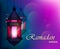 Ramadan Kareem beautiful greeting card with traditional Arabic lantern on blurred purple background.