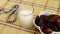 Ramadan Kareem Festival. Close up of dried dates fruit in bowl with rosary on wooden background.