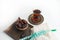 Ramadan Kareem Festival, Dates on wooden bowl with cup of black tea and rosary on white  background