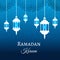 Ramadan Kareem greeting blue evening background arabic design patterns and lanterns, arabic lamp for promotion banner