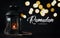 Ramadan Kareem Greeting Typography Beautiful Bokeh. Ramadan Candle Lantern with Wooden Prayer Beads