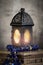 Ramadan lantern  lighten up and a Blue Arabic rosary over an arabesque box in a vintage mood or environment